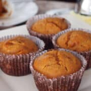 Carrot muffins on white dish.
