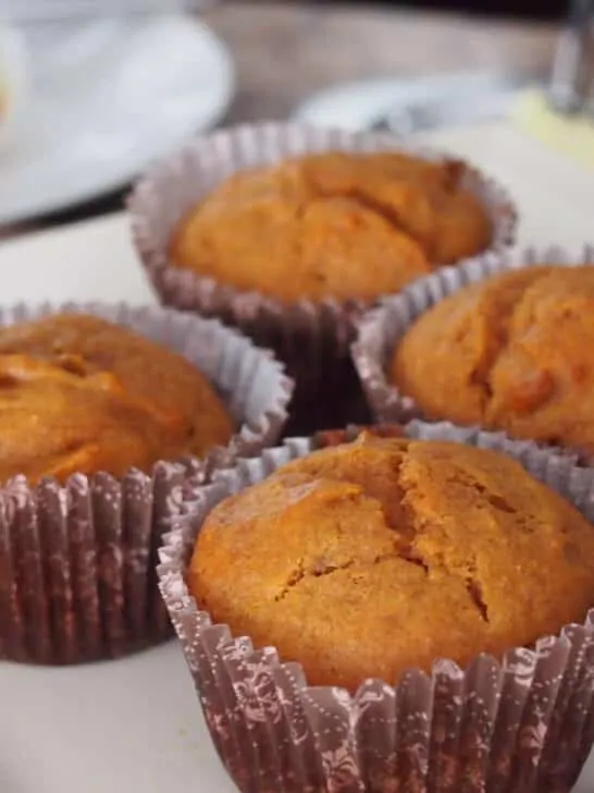 Carrot muffins on white dish.