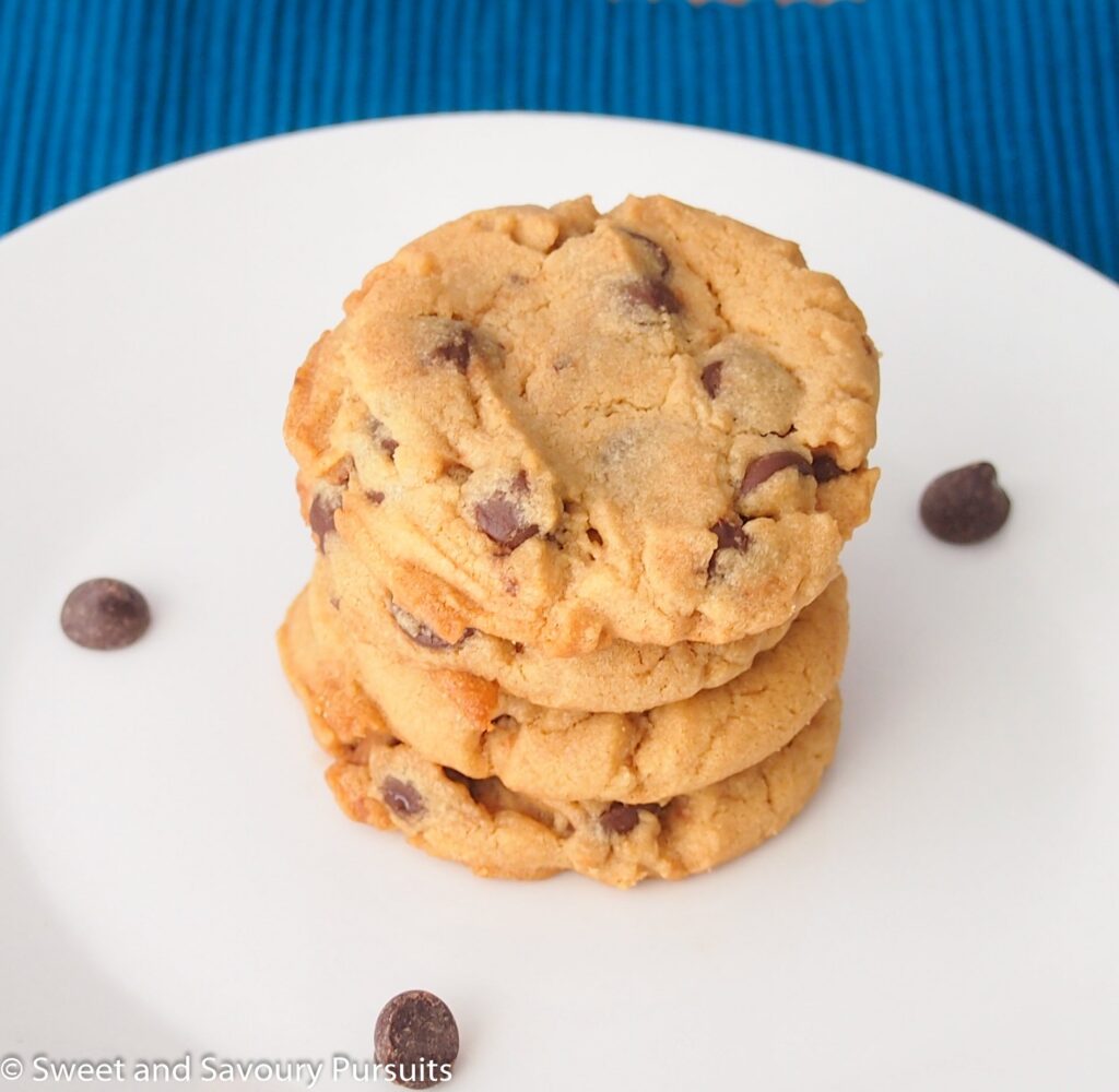 Peanut butter and chocolate chip cookies on dish.