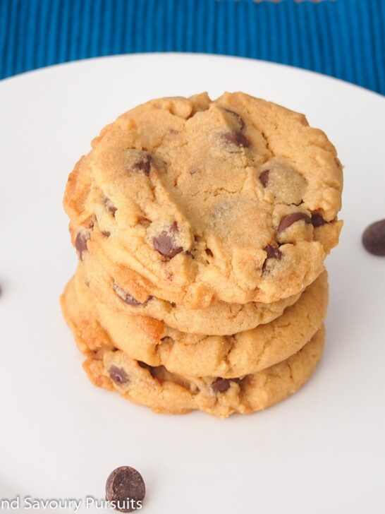 Peanut butter and chocolate chip cookies on dish.