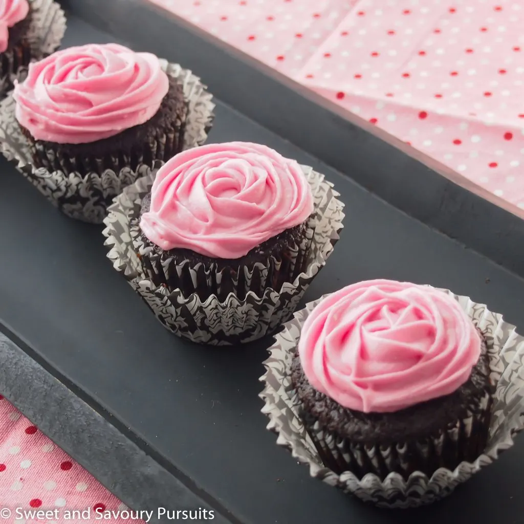 Chocolate beetroot cupcakes on tray.