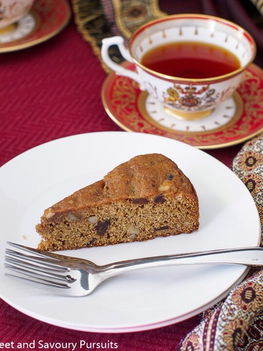 Slice of Date and Walnut Cake on small dish.
