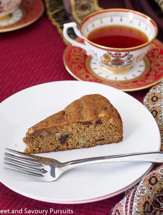 Slice of Date and Walnut Cake on small dish.