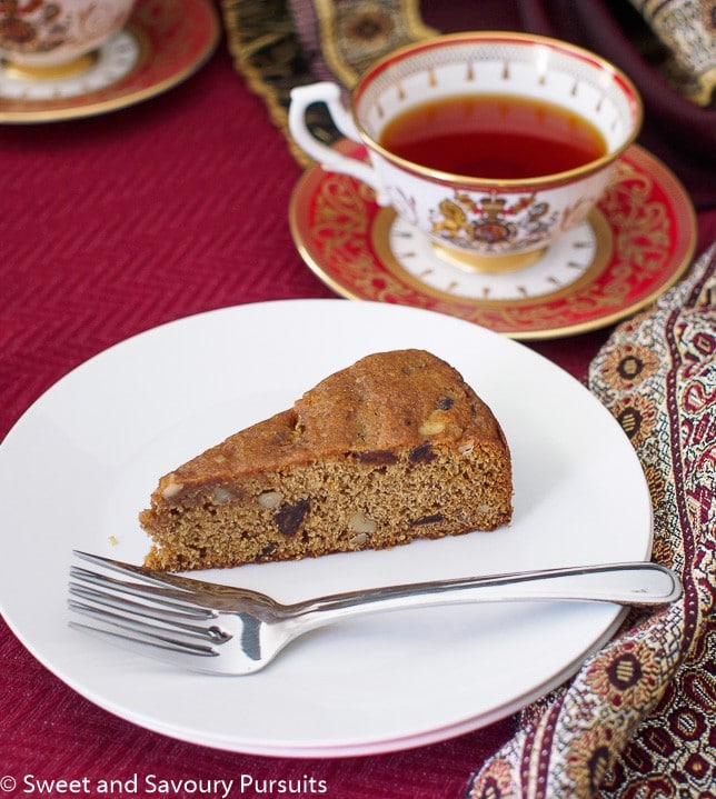 Slice of Date and Walnut Cake on small plate.