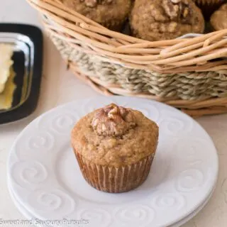 Banana nut muffin on dish.