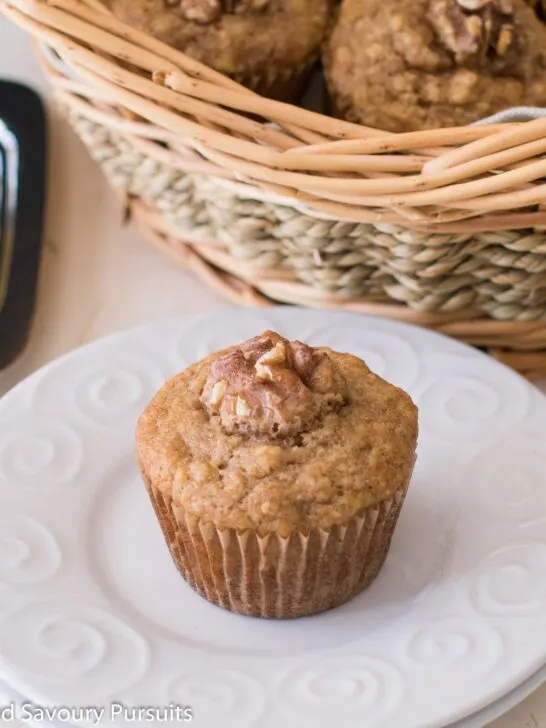 Banana nut muffin on dish.