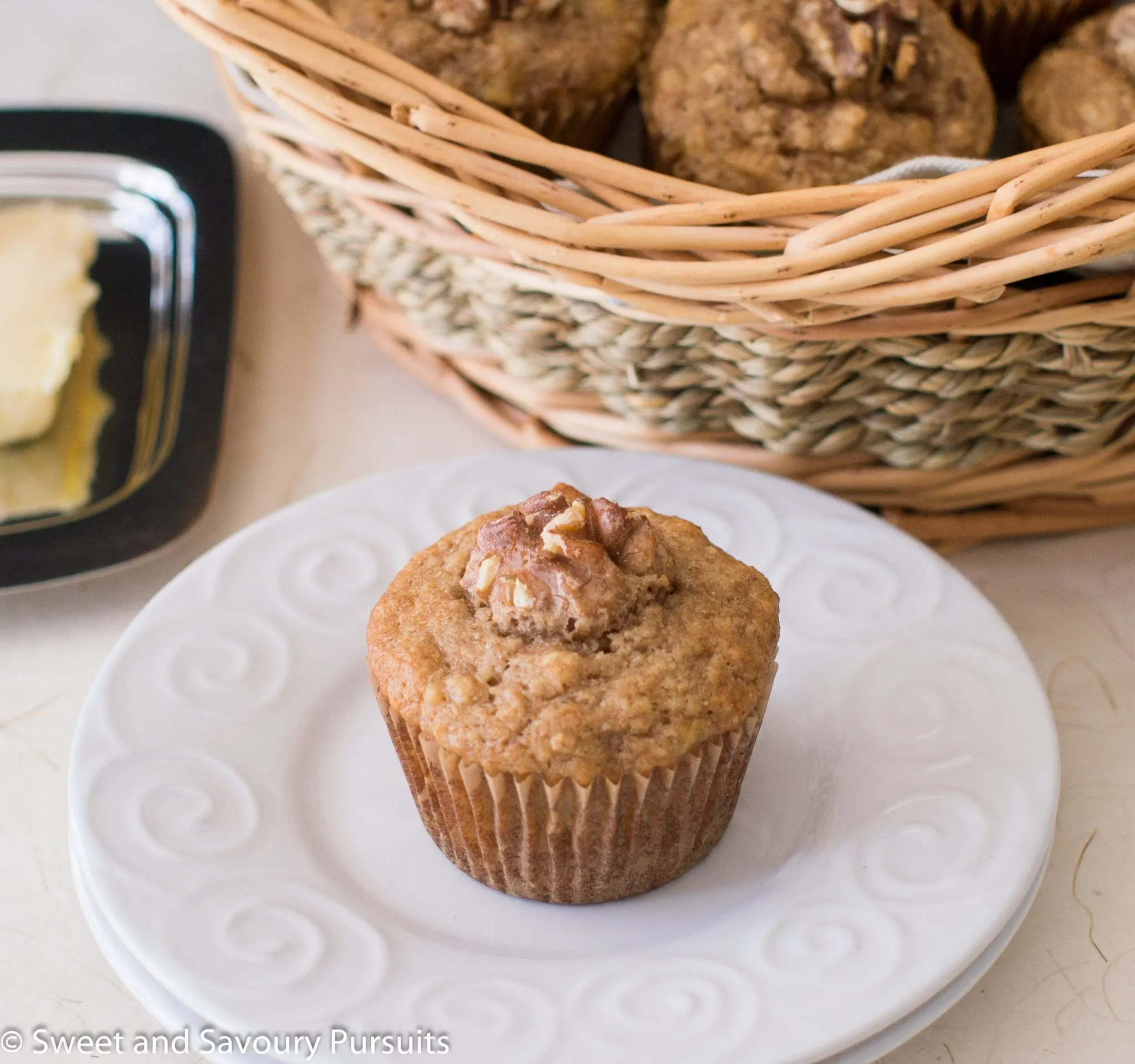 Banana nut muffin on dish.