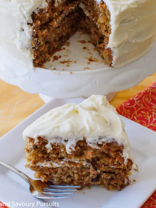 A slice of carrot cake on a dish.