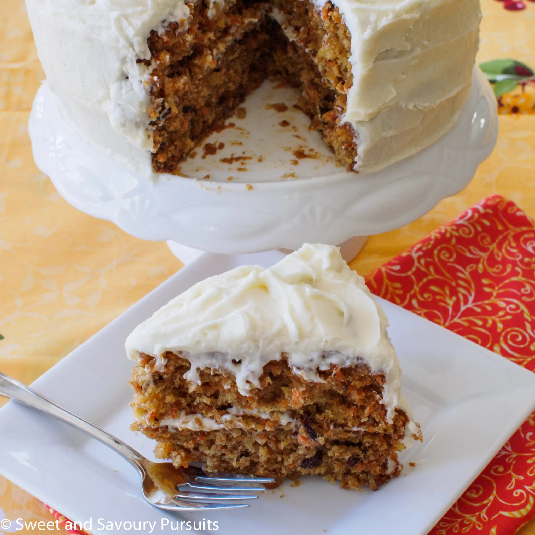 A slice of carrot cake on a dish.