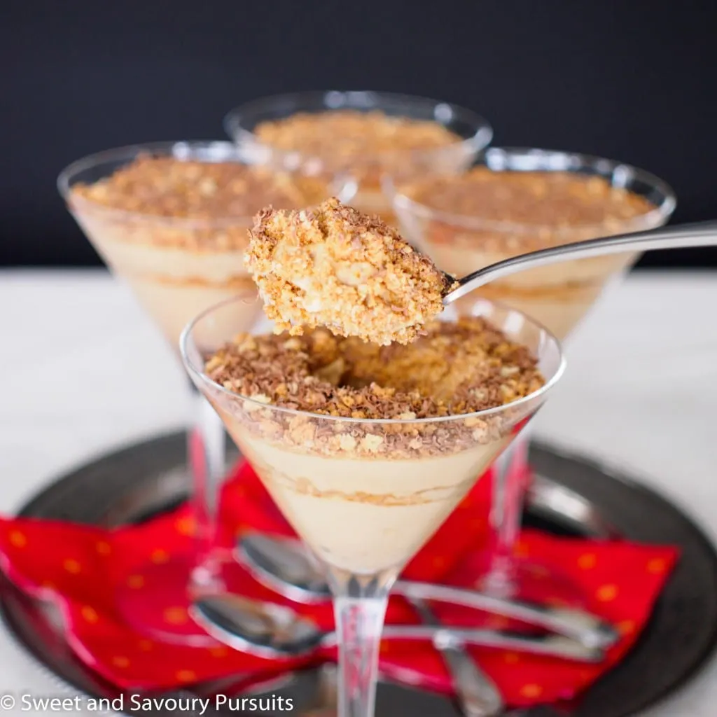 Close-up of a spoonful of Mascarpone Espresso and Amaretti Parfaits.