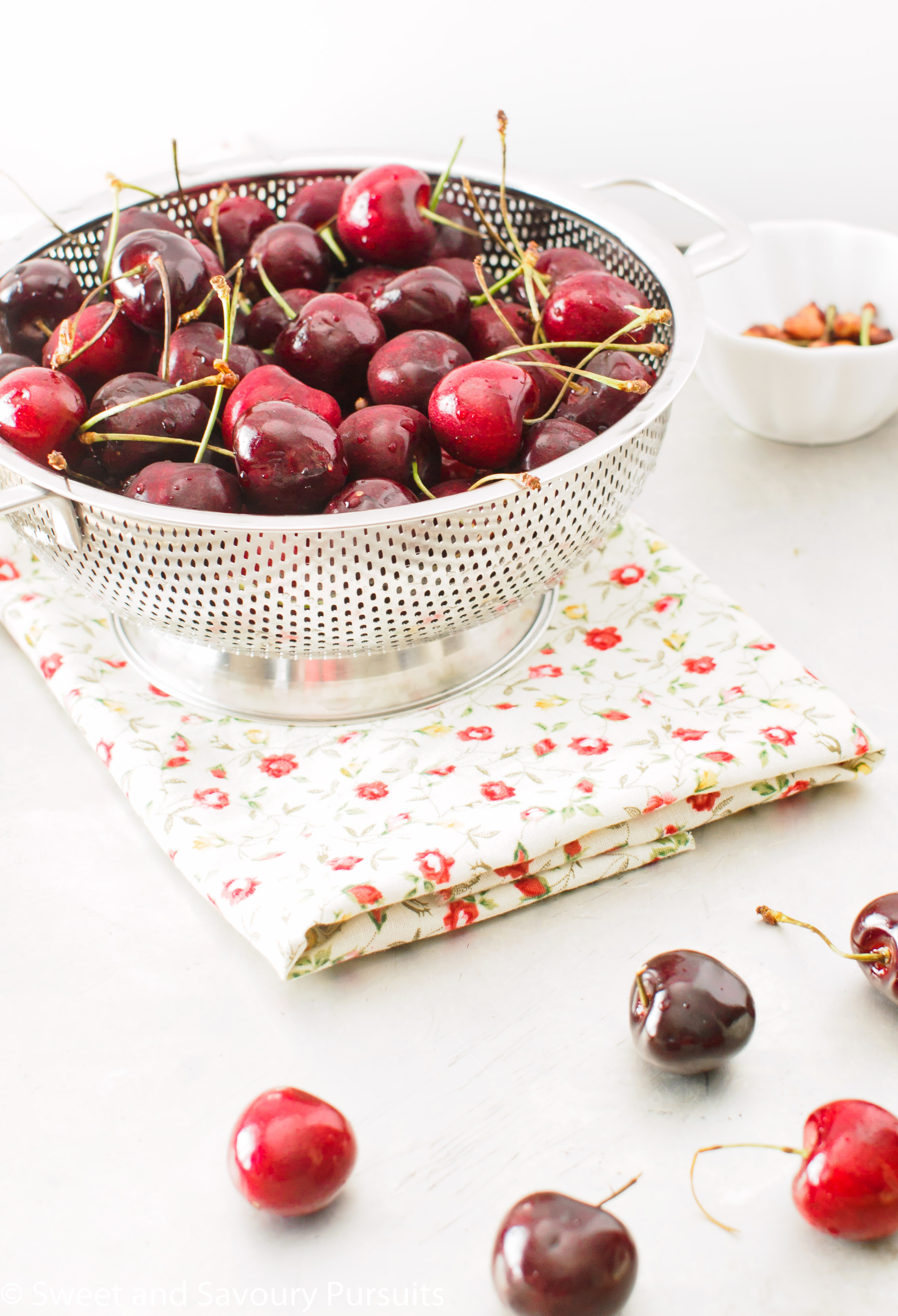 Colander full of freshly washed cherries.