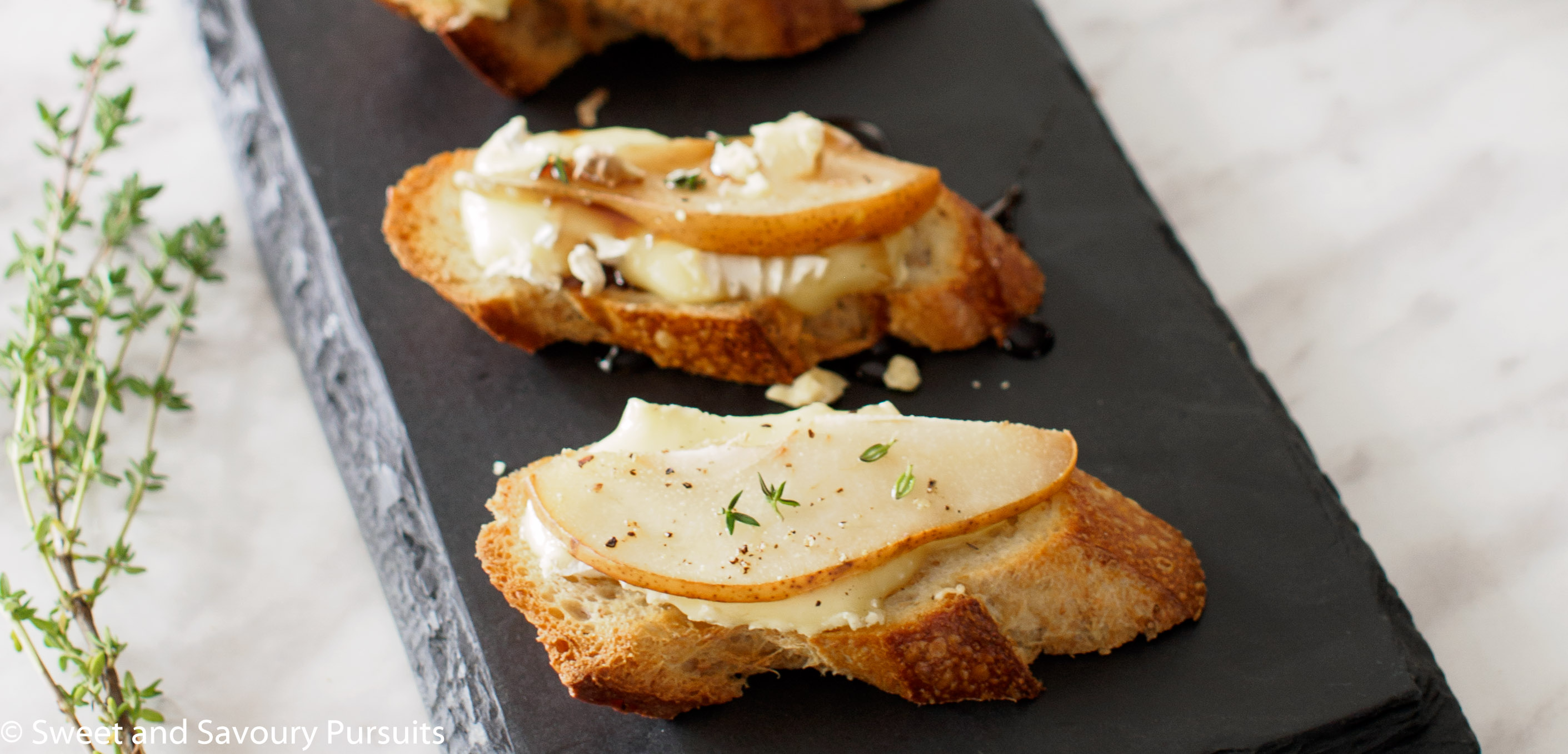 Pear and Brie Crostini on platter.