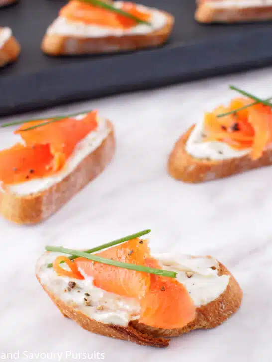 Crostini topped with Boursin cheese and smoked salmon.