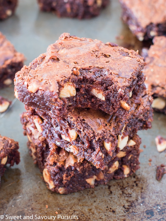 Three Nutella hazelnut brownies stacked on top of each other.