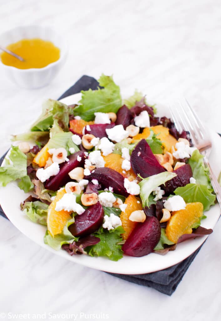 Plate of Roasted Beet and Orange Salad served with Citrus Vinaigrette.