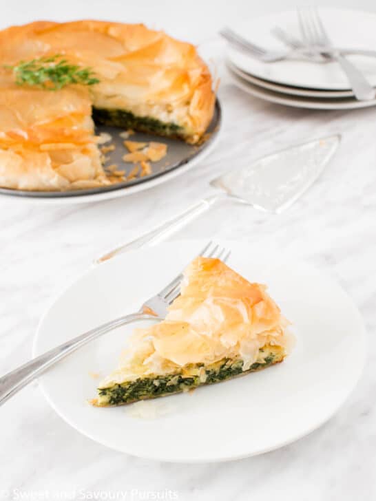 Slice of Spanakopita pie on dish.