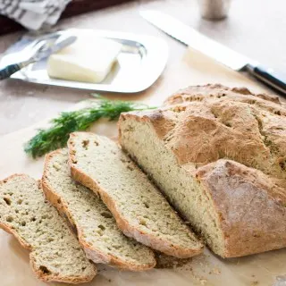 Sliced Irish Soda Bread with Dill on board.