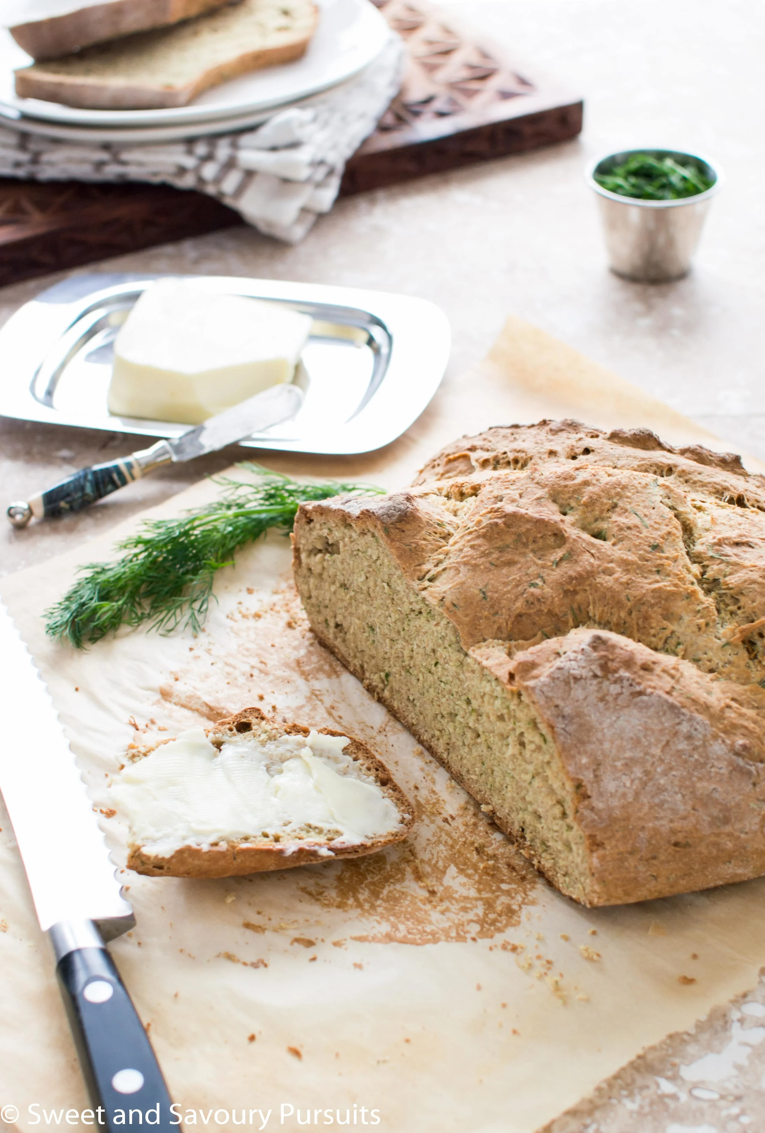 Irish Soda Bread with cut and buttered slice.