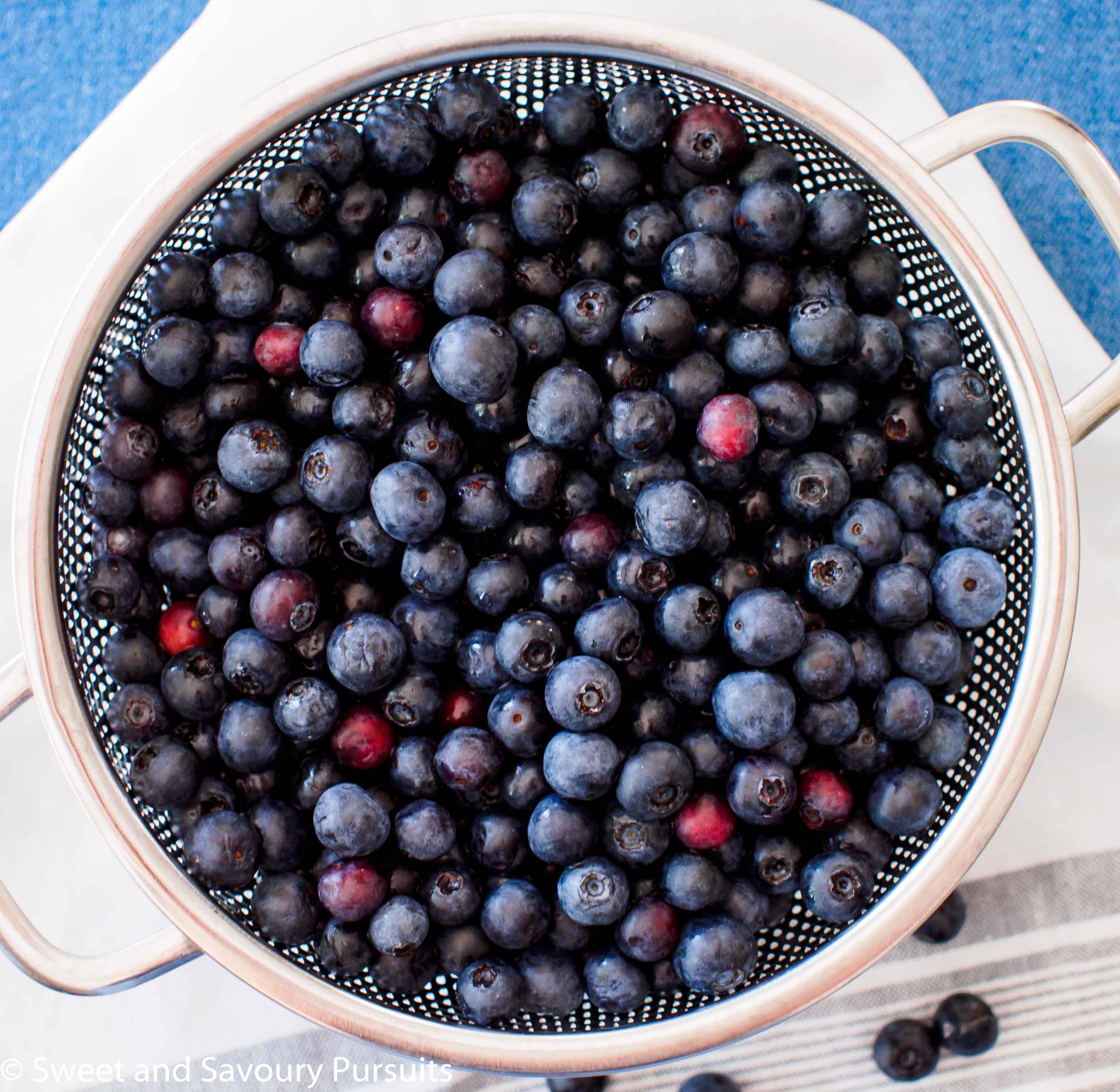 Rinsed blueberries in colander.