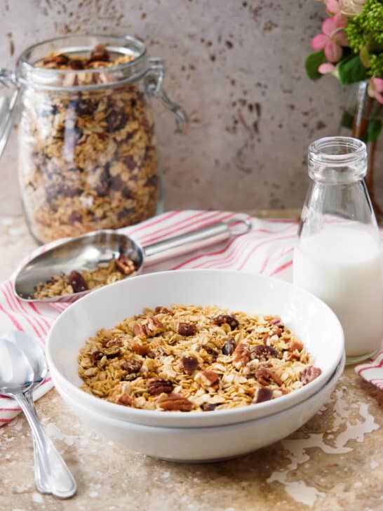 Bowl of vegan Homemade Maple Pecan Granola with Dates.