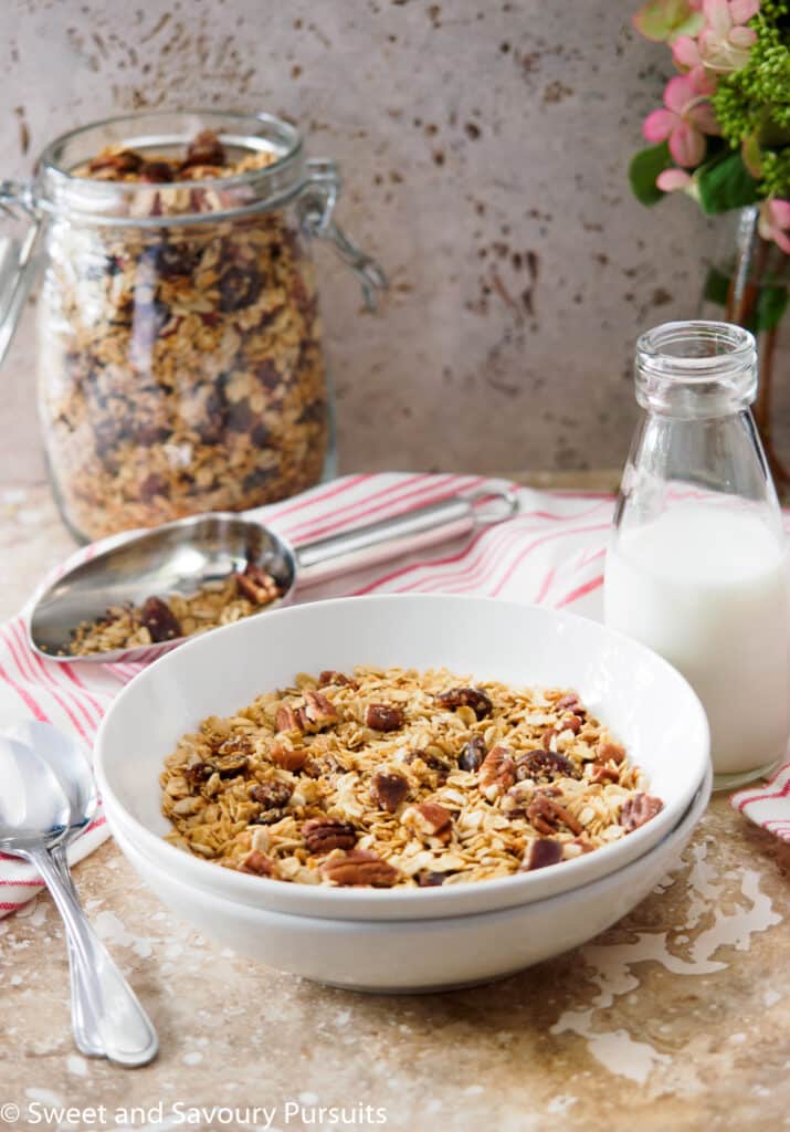 Bowl of vegan Homemade Maple Pecan Granola with Dates