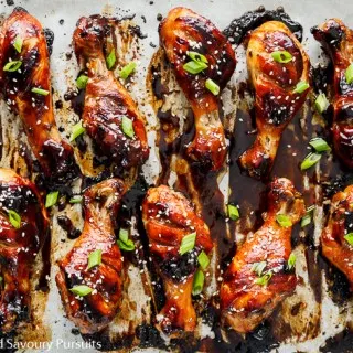 Sticky Chicken Drumsticks on baking tray.