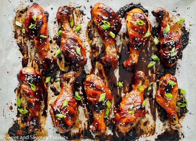 Sticky Chicken Drumsticks on baking tray.