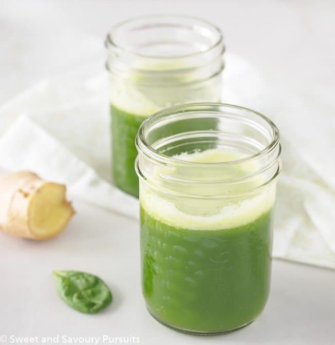Pineapple Spinach Juice with Ginger in small mason jar.