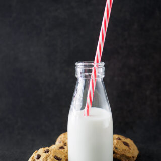 Chickpea Chocolate Chip Cookies with a bottle of milk.