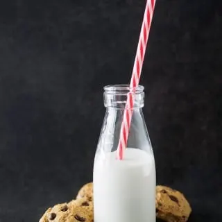 Chickpea Chocolate Chip Cookies with a bottle of milk.