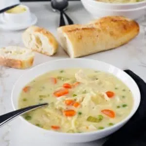 Bowl of creamy chicken noodle soup.