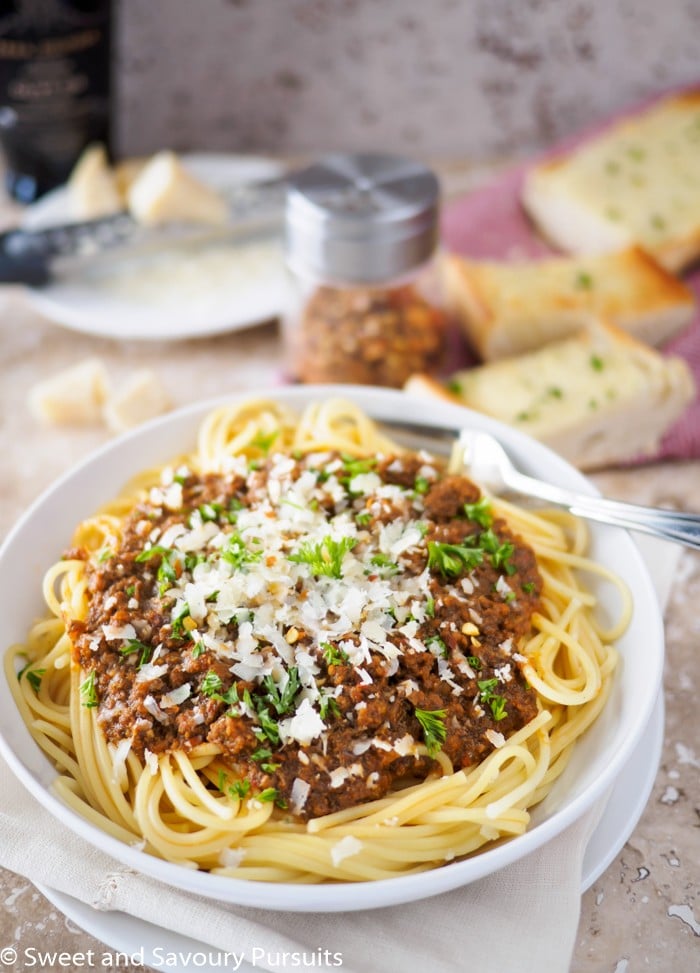 Bowl of spaghetti topped with meat sauce.