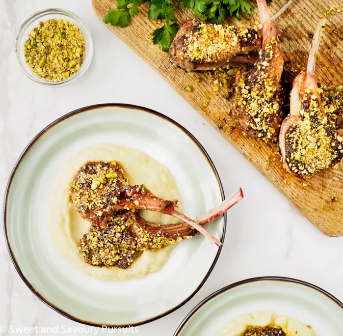 Plate of Dukkah-Crusted Lamb Chops on bed of Cauliflower and Potato Purée.