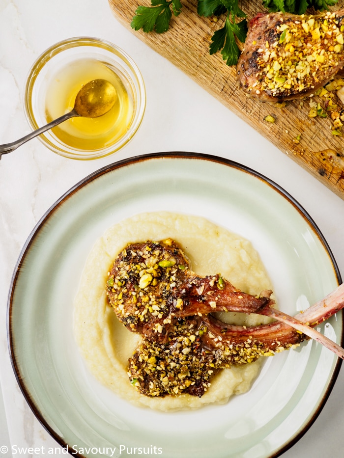 Dukkah-crusted lamb chops on a bed of cauliflower and potato purée.