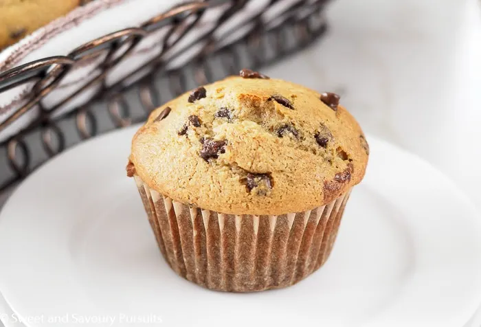 Banana chocolate chip muffin on dish.