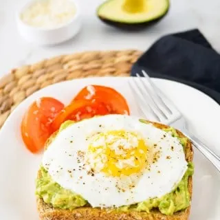 Toast topped with avocado and fried egg.