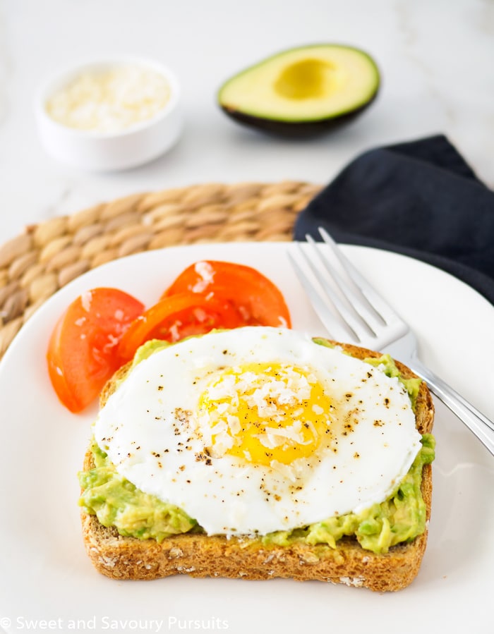 Toast topped with avocado and fried egg.