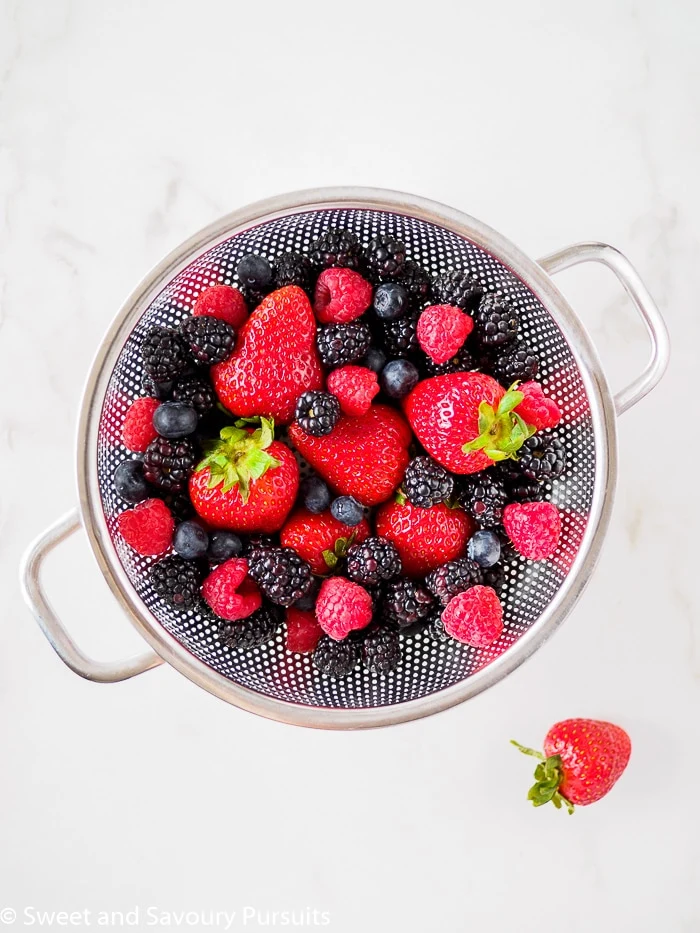 Bowl of mixed berries - strawberries, blueberrie, raspberries and blackberries.