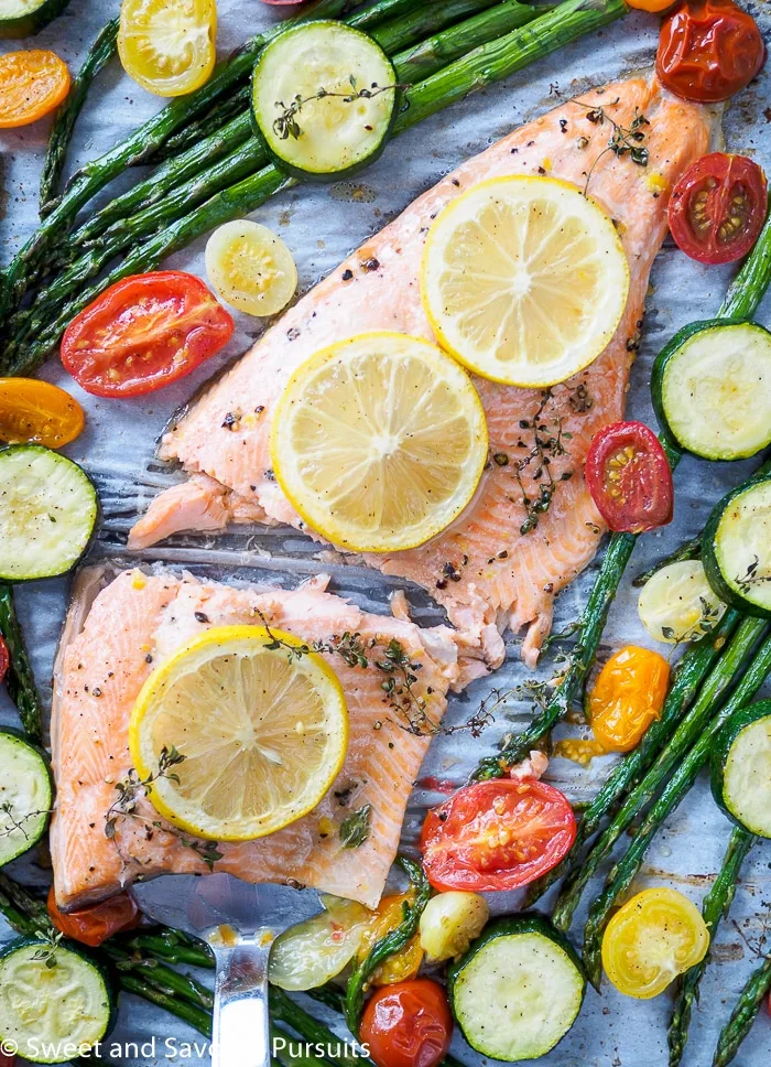 Rainbow Trout Fillet with asparagus, cherry tomatoes and zucchini baked all on one tray.