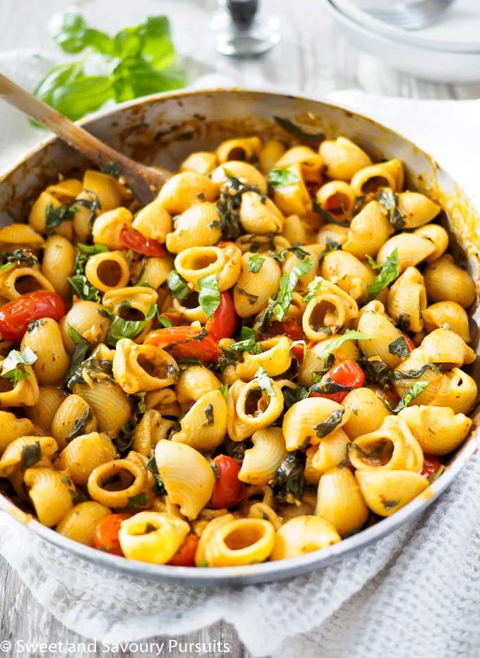 Creamy Tomato and Spinach Pasta in skillet.