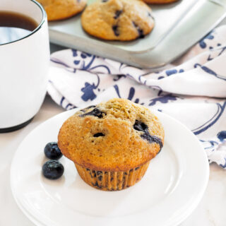 Whole Wheat Blueberry Lemon Muffin served with a cup of coffee