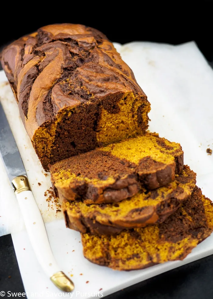 Sliced chocolate swirled pumpkin loaf.