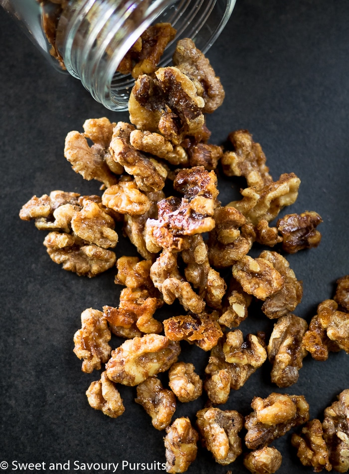 Maple Spiced Walnuts on dark background.