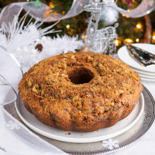 Cinnamon swirl bundt cake on platter.