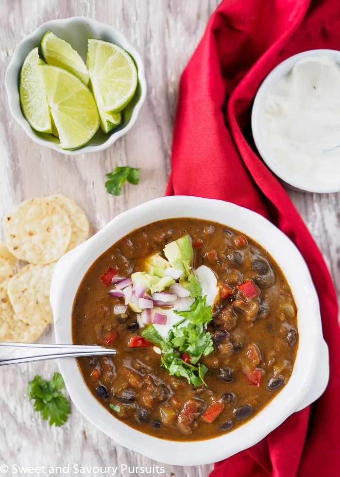Bowl of Black Bean Soup with toppings.