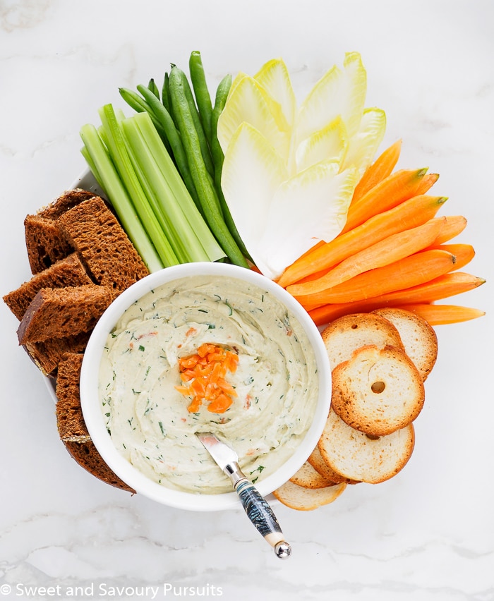Smoked Salmon Cream Cheese Dip served with vegetables, pumpernickel bread, and bagel crisps