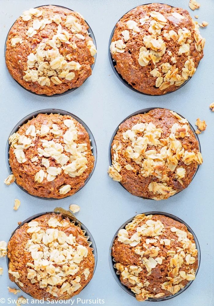 Baked Whole Wheat Carrot Muffins in muffin pan.