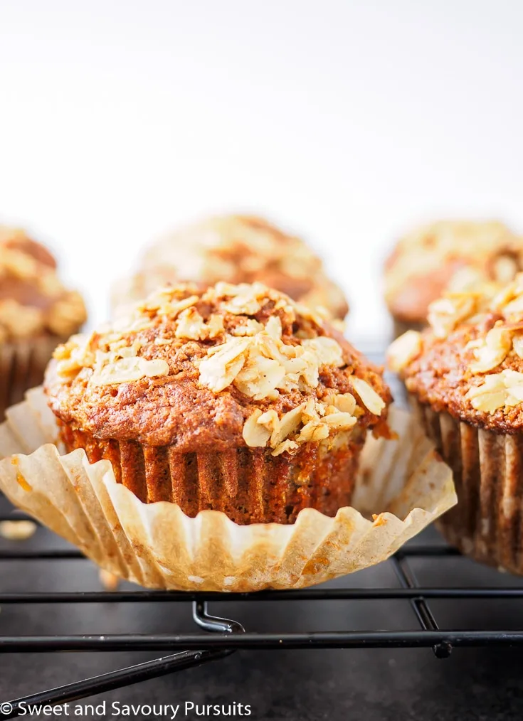 Freshly baked Whole Wheat Carrot Muffins on cooling rack.