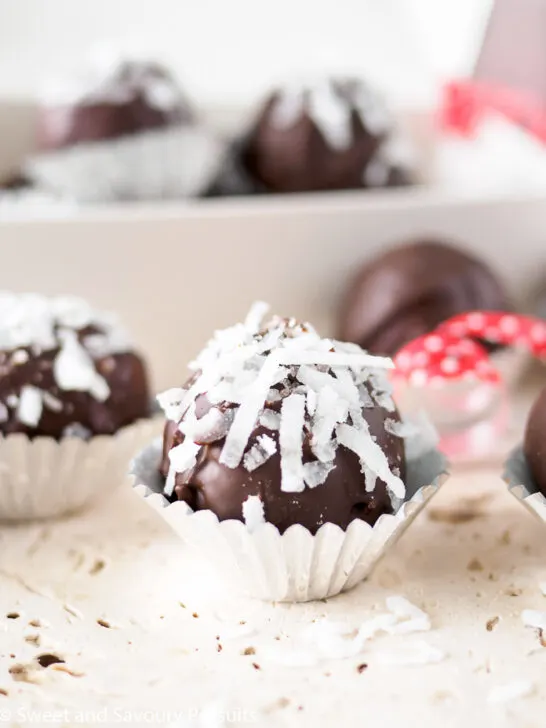 Chocolate Coconut Almond Truffles in foil candy cups.