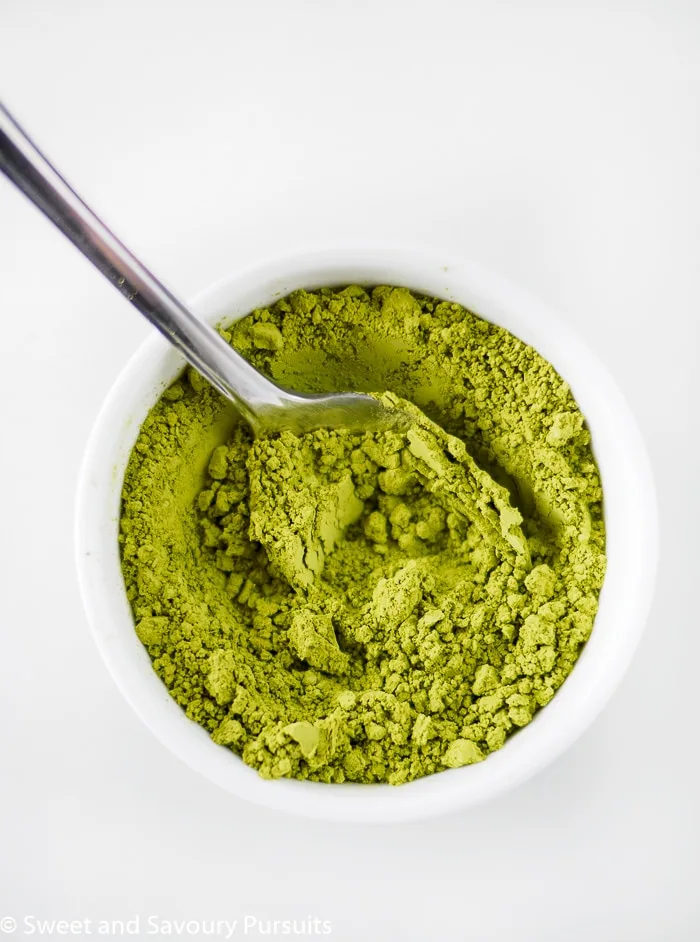 Matcha powder in small bowl.